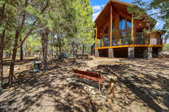 2288 Richenbacher Cir, Overgaard, AZ 85933 - view of property exterior with a wooden deck and stone siding