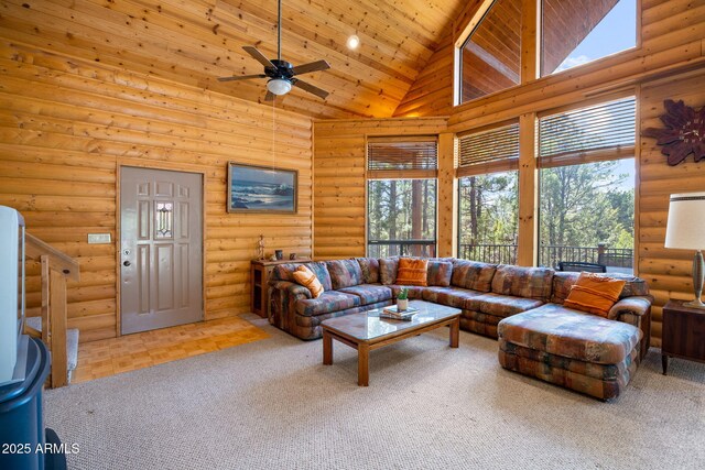 2288 Richenbacher Cir, Overgaard, AZ 85933 - carpeted living room with high vaulted ceiling, a ceiling fan, rustic walls, stairway, and wood ceiling