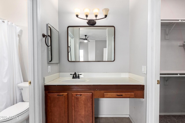 1102 N 5th St, Buckeye, AZ 85326 - bathroom with vanity, a ceiling fan, a spacious closet, and curtained shower