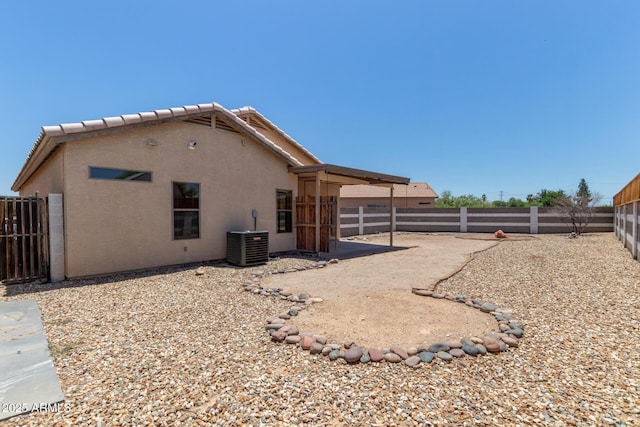 1102 N 5th St, Buckeye, AZ 85326 - back of property featuring a fenced backyard and stucco siding