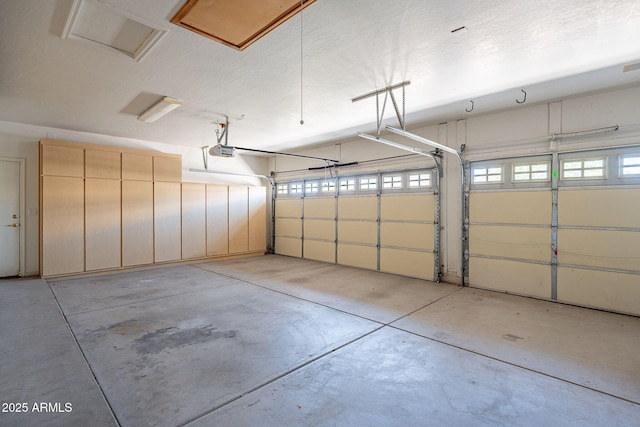 garage featuring a garage door opener