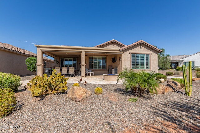 view of front of property with a patio