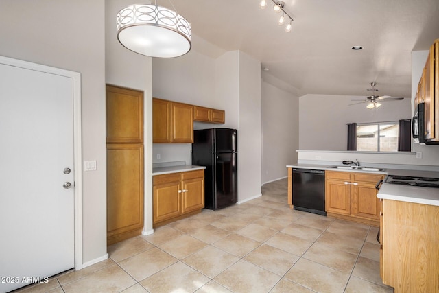 kitchen with light countertops, light tile patterned floors, black appliances, a ceiling fan, and a sink