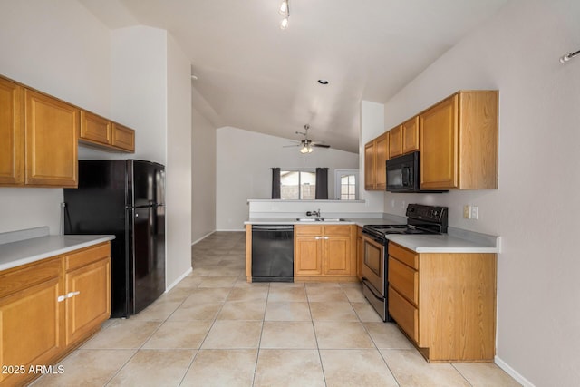 kitchen featuring light countertops, vaulted ceiling, light tile patterned floors, a peninsula, and black appliances