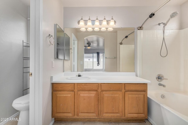 full bath with vanity, a ceiling fan, shower / bathtub combination, and toilet