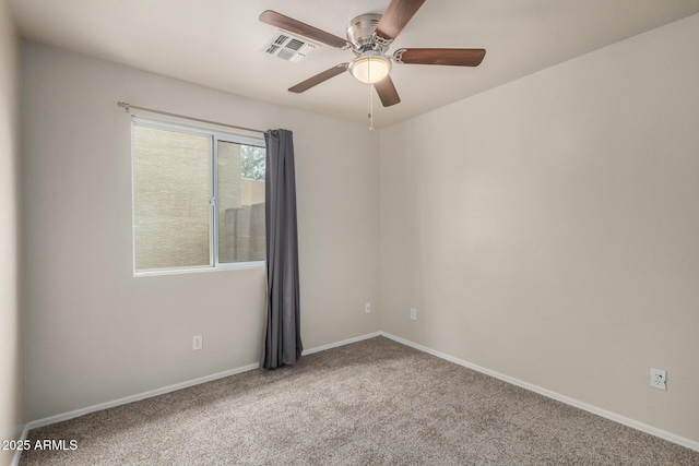 unfurnished room featuring visible vents, baseboards, carpet, and a ceiling fan