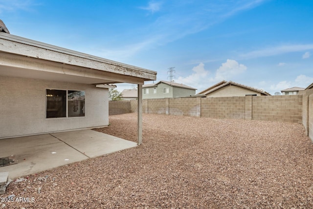 view of yard with a patio area and a fenced backyard