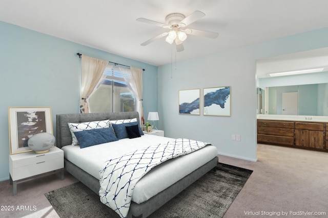 carpeted bedroom featuring ceiling fan, sink, and ensuite bathroom