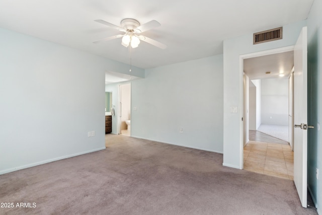 carpeted empty room with ceiling fan