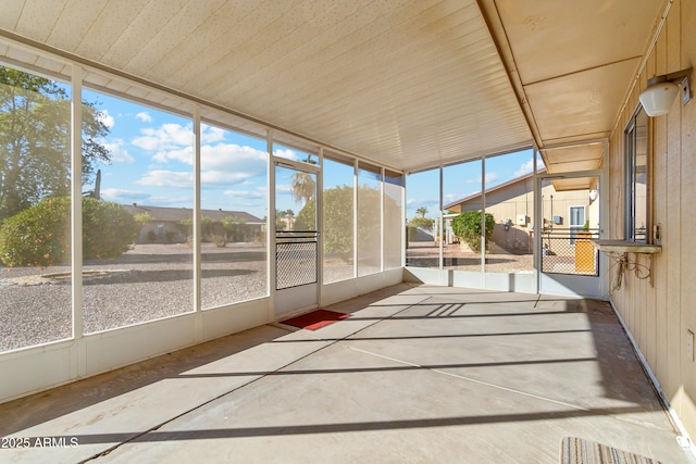 unfurnished sunroom with a healthy amount of sunlight