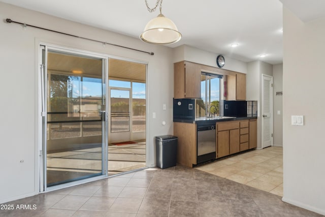 kitchen with dishwasher, light tile patterned flooring, a healthy amount of sunlight, and sink