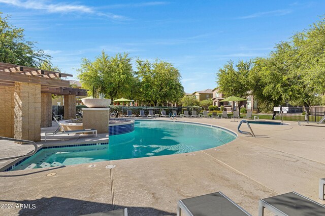 view of pool featuring a pergola and a patio area