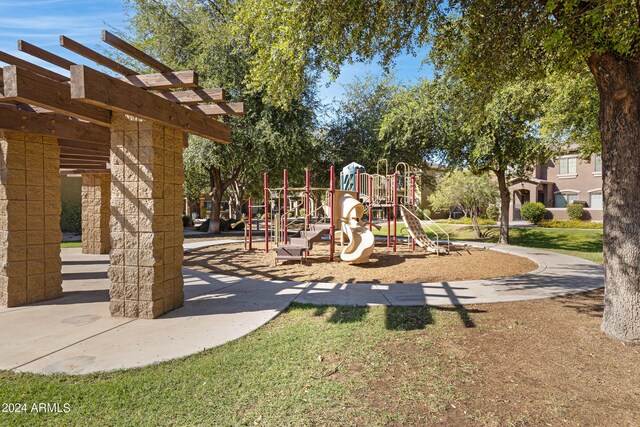 view of playground featuring a lawn