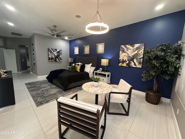 living room featuring light tile patterned floors and ceiling fan