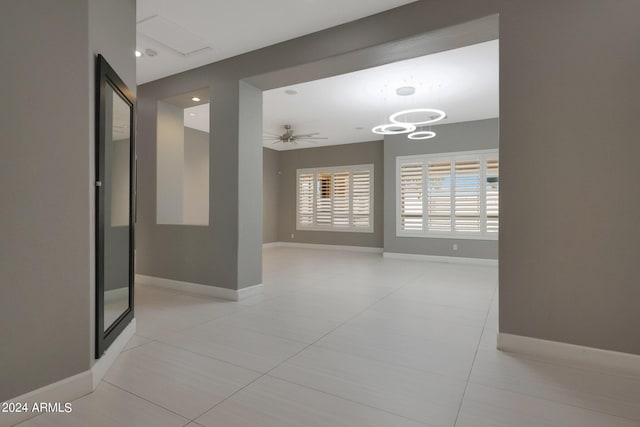 corridor with light tile patterned floors