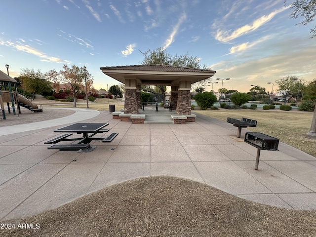 view of property's community with a playground and a gazebo