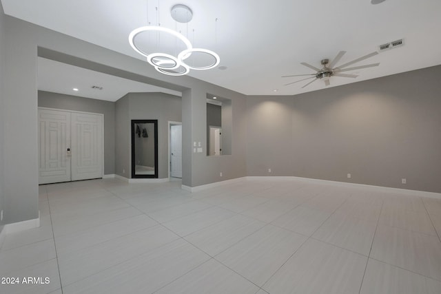 tiled empty room with ceiling fan