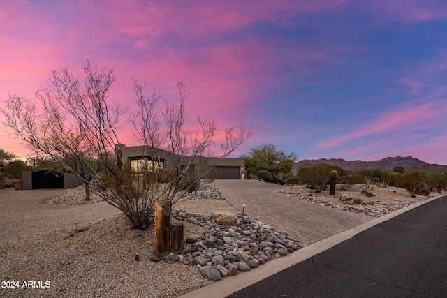 view of front of property featuring a mountain view and a garage