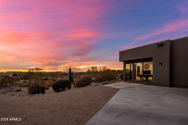 view of patio terrace at dusk