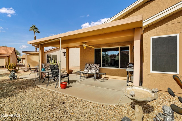 view of patio / terrace with ceiling fan and a grill