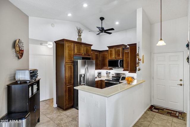 kitchen with decorative light fixtures, vaulted ceiling, kitchen peninsula, ceiling fan, and stainless steel appliances