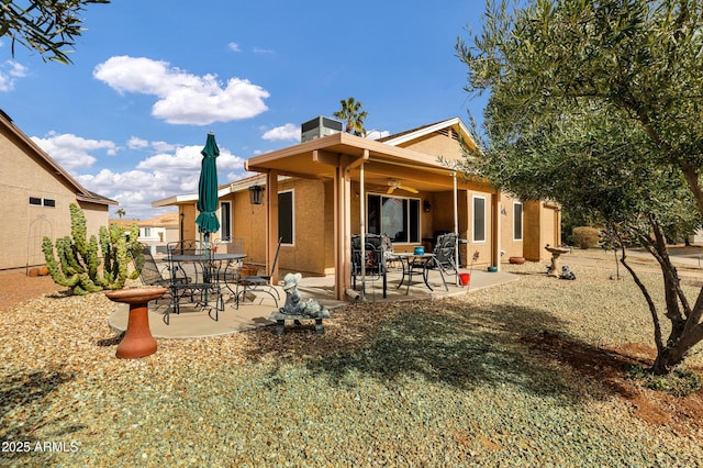 rear view of property featuring a patio