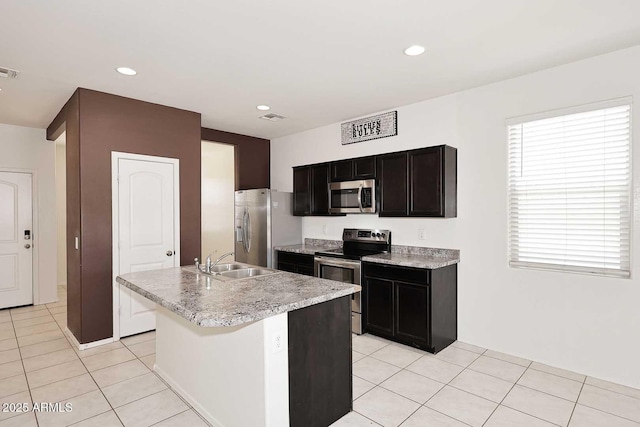 29932 N Paloverde Dr, Florence, AZ 85132 - kitchen featuring stainless steel appliances, a sink, light countertops, a kitchen island with sink, and light tile patterned floors