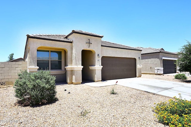 29932 N Paloverde Dr, Florence, AZ 85132 - mediterranean / spanish house featuring a garage, driveway, stucco siding, and a tile roof