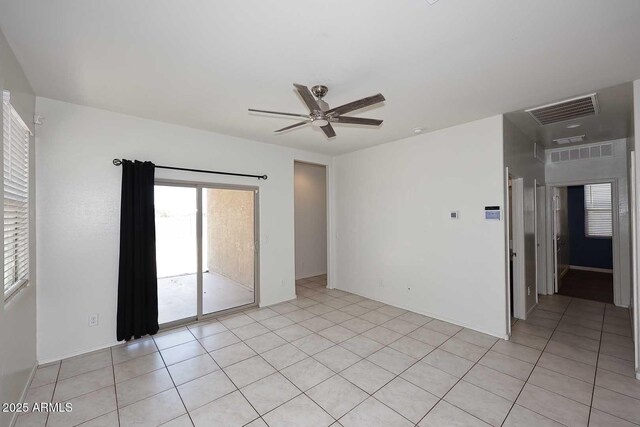 29932 N Paloverde Dr, Florence, AZ 85132 - unfurnished room featuring healthy amount of natural light, ceiling fan, and light tile patterned floors
