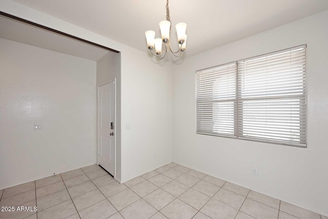 29932 N Paloverde Dr, Florence, AZ 85132 - spare room featuring a chandelier and light tile patterned floors