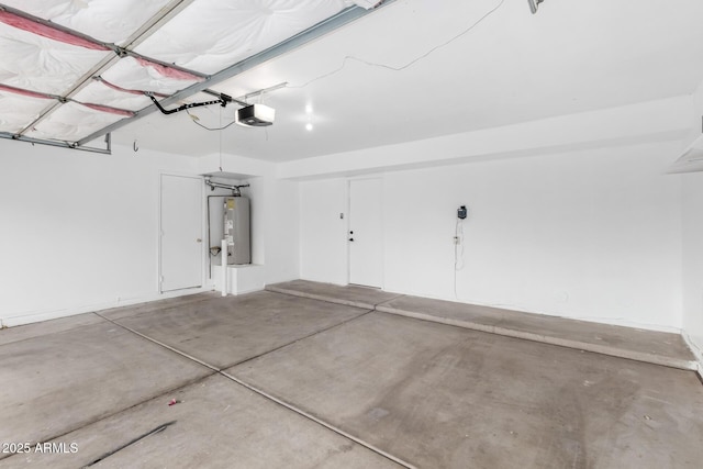 garage featuring a garage door opener and electric water heater