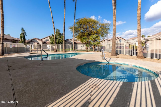 view of swimming pool with a patio