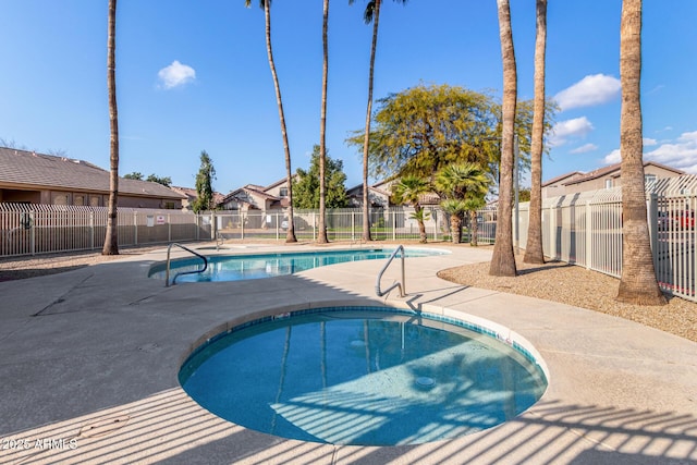 view of swimming pool with a patio