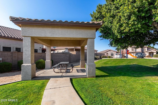 surrounding community with a patio area and a lawn