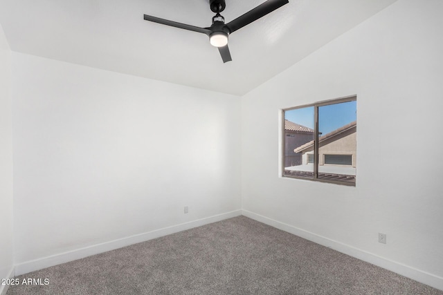 carpeted empty room featuring ceiling fan and lofted ceiling