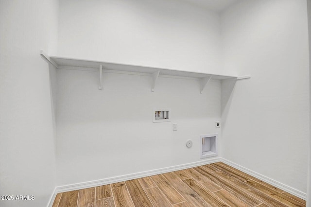 laundry area with washer hookup, hardwood / wood-style floors, hookup for an electric dryer, and gas dryer hookup