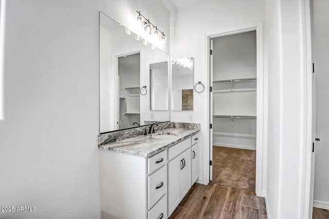 bathroom featuring wood-type flooring and vanity