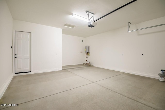 garage with a garage door opener and water heater