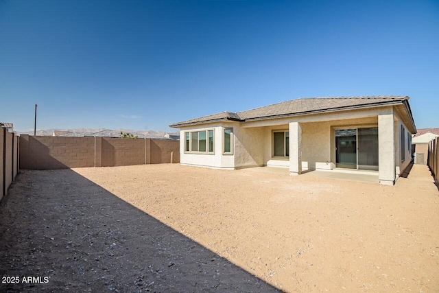 rear view of property featuring a patio