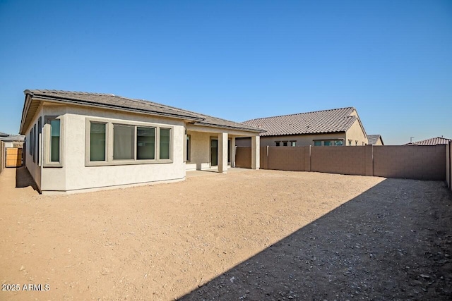 back of house featuring a patio