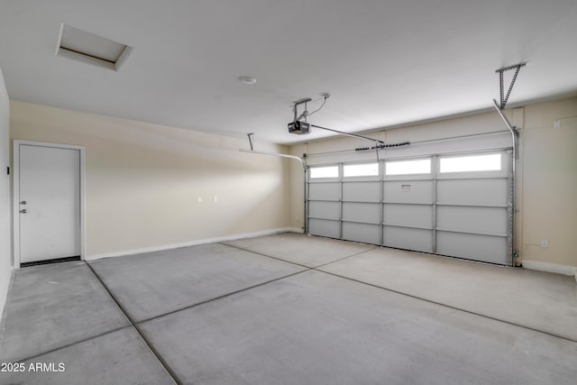 garage featuring baseboards and a garage door opener