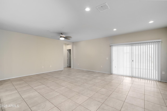 empty room featuring light tile patterned floors, recessed lighting, visible vents, ceiling fan, and baseboards