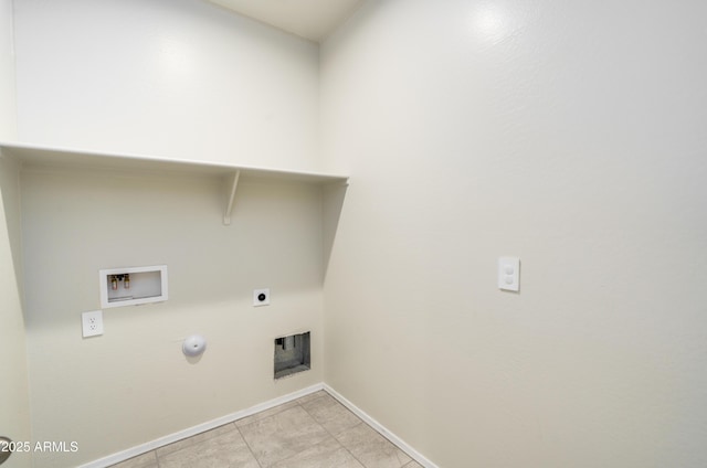 clothes washing area featuring gas dryer hookup, laundry area, washer hookup, baseboards, and electric dryer hookup