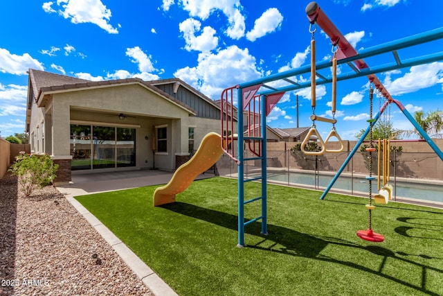 3031 S Valerie Dr, Chandler, AZ 85286 - communal playground with a lawn, a fenced backyard, and a patio area