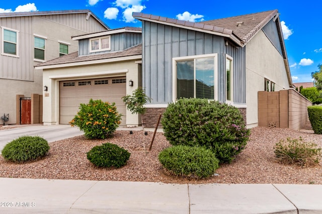 3031 S Valerie Dr, Chandler, AZ 85286 - view of front facade with a garage, board and batten siding, and concrete driveway