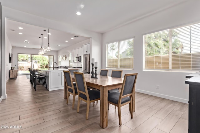 3031 S Valerie Dr, Chandler, AZ 85286 - dining room with recessed lighting, baseboards, and light wood-style flooring