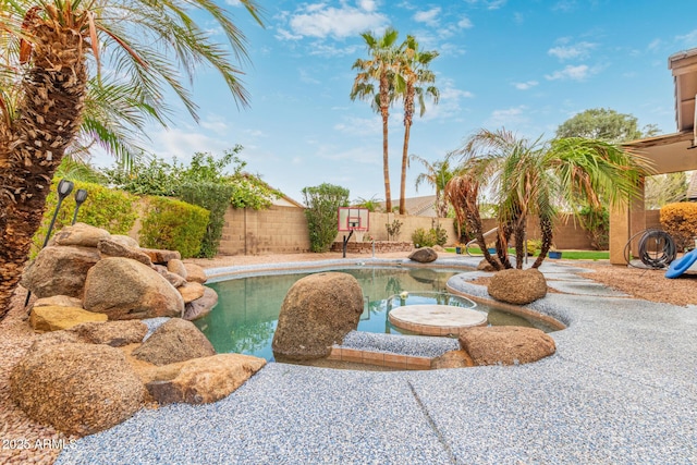 view of swimming pool with a patio, a fenced backyard, and a fenced in pool