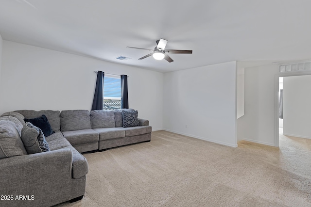 living room with ceiling fan and light colored carpet