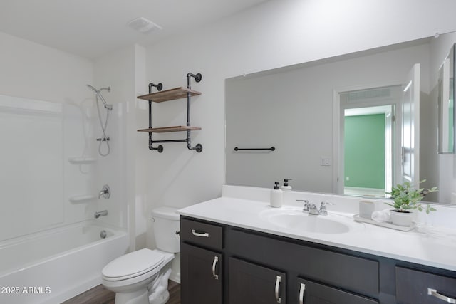 full bathroom featuring shower / bathtub combination, vanity, and toilet