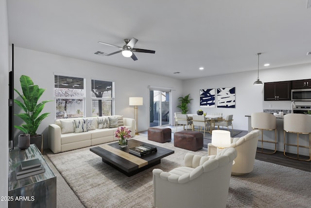 living room featuring hardwood / wood-style flooring and ceiling fan